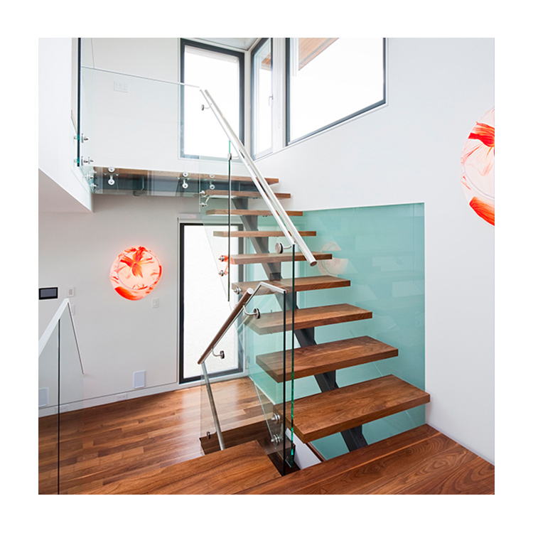 Diseños de escaleras con barandillas de vidrio para casas

