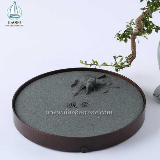 Bandeja de té de piedra tallada de insectos de forma redonda de granito gris de China
